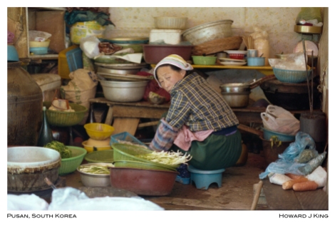 Color Picture of a open stall owner in Pusan, Korea. Image was recovered from a color negative. Howard J King 1984